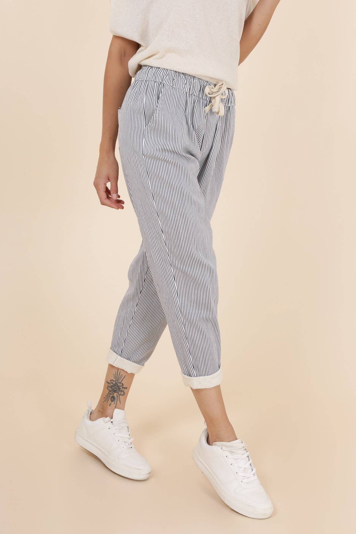 STRIPED PANTS WITH LACE CUFFS